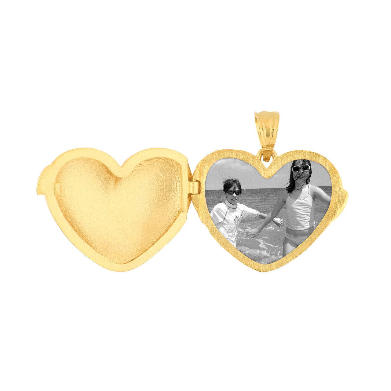 Simple heart locket in silver with a polished finish, featuring a classic design and delicate hinges.
