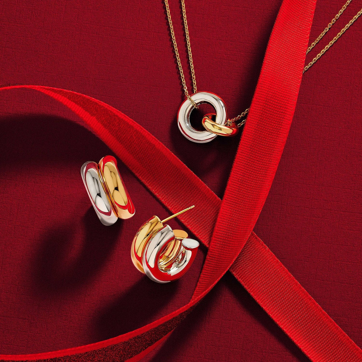 14K two-tone gold intertwine necklace and double hoop earrings with red ribbon