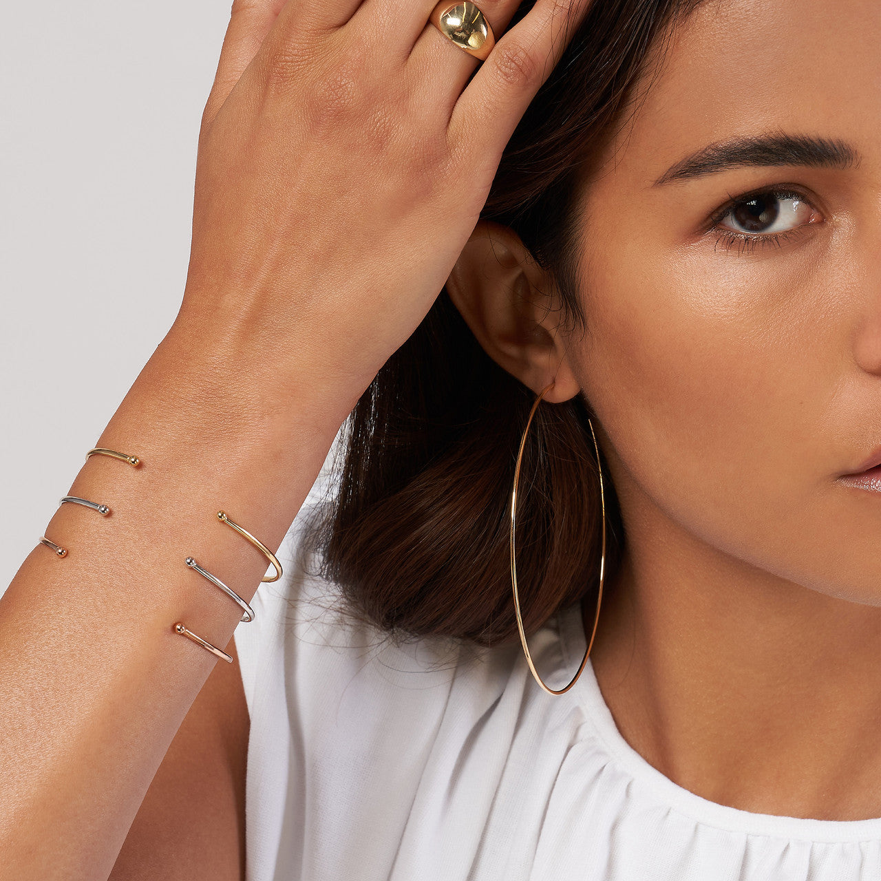 14K gold cuff bangle with beaded ends, detail view