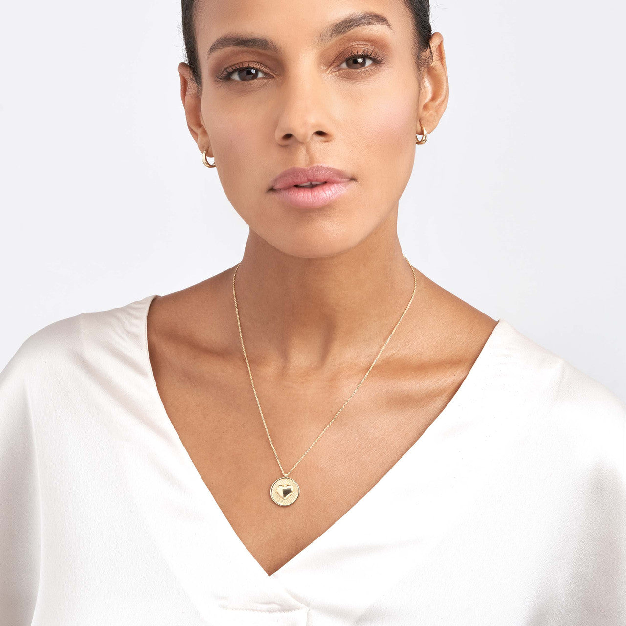 14K gold chevron and puff heart medallion necklace, detail view